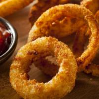 Onion Rings · Perfectly sliced thick onion rings, battered and deep-fried to perfection.