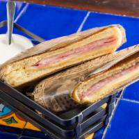 Jamon Y Queso Sandwich · Ham and cheese with garlic sauce.