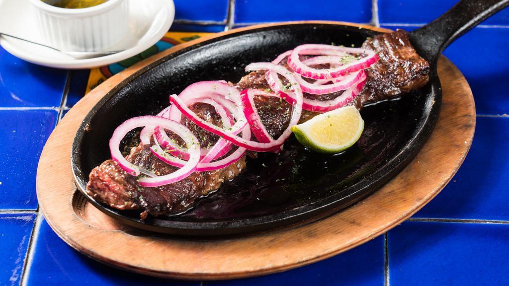 Churrasco · Grilled marinated skirt steak. served with 2 sides.
