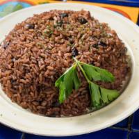 Arroz Moro · Black beans and white rice mixed with pork.