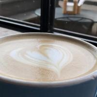 Latte · Steamed milk based beverage top with our signature medium-dark roast espresso shot.