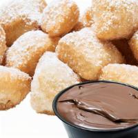Nutella Fried Yummy Dough · Our original fried dough, topped with powdered sugar, served with a side of NUTELLA for dipp...