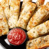 Cheesey Yummy Bread Sticks · 12 pc Oven baked garlic buttered breadsticks topped with seasonings, and Parmesan, cheddar a...