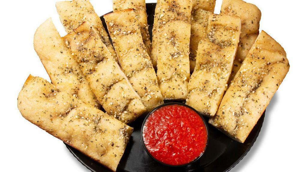 Original Yummy Bread Sticks · 12 pc Oven baked garlic buttered breadsticks topped with seasonings, and Parmesan cheese. Served with pizza sauce for dipping.