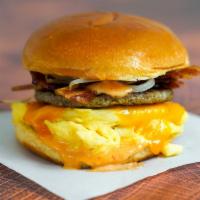 Big Breakfast Sammy · 2 scrambled eggs, melted Cheddar cheese, bacon, breakfast sausage, grilled onions  and Srira...