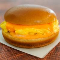 Brioche, Egg, And Cheese · 2 fresh cracked cage-free scrambled eggs, melted American cheese, and Sriracha aioli in a wa...