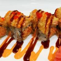 Salmon Roll · Spicy crunchy crab topped with tempura salmon, tobiko, spicy mayo, and eel sauce.