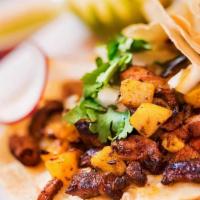 Al Pastor Taco (Order Of 3) · Marinated pork with grilled pineapple and onions. Tacos topped with fresh onions and cilantr...