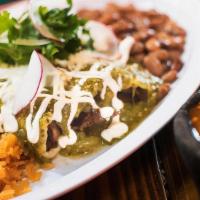 Steak Enchiladas · Three soft corn tortillas smothered with your choice of sauce and topped with chopped cilant...