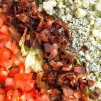 Chopped Wedge Salad · Iceberg lettuce, tomatoes, bacon, and blue cheese crumbles w/ choice of dressing on the side