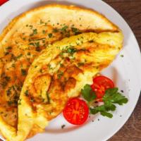 Western Omelette · Fresh eggs filled with ham, onions and peppers served with home fries and toast.