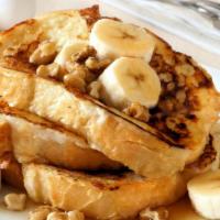 Banana French Toast · Original banana fluffy triangle shaped French toast slices served with butter and syrup.