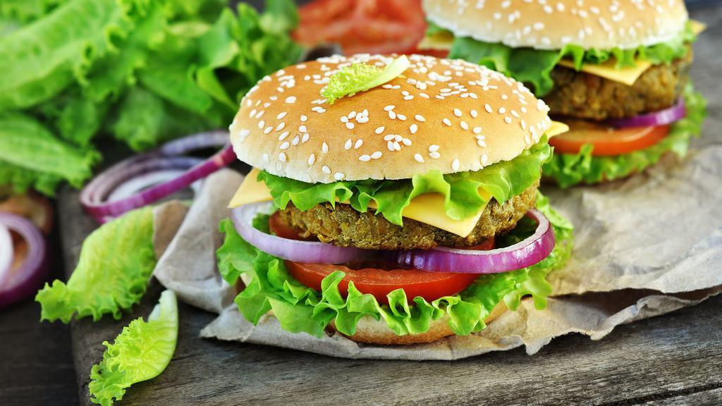 Veggie Cheeseburger · A seasoned all-natural veggie patty with tomatoes, lettuce, onions and customer's choice of sauces served on a fresh baked bun.