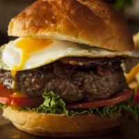 Texas Burger · Elegant burger with beef patty, fried eggs, lettuce, tomatoes, onions and customers choice o...