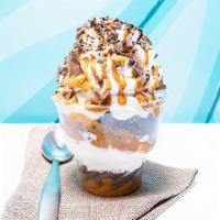 Peanut Butter Crunch · Vanilla ice cream with peanut butter sauce, peanut butter cups and chocolate crunch. Topped ...