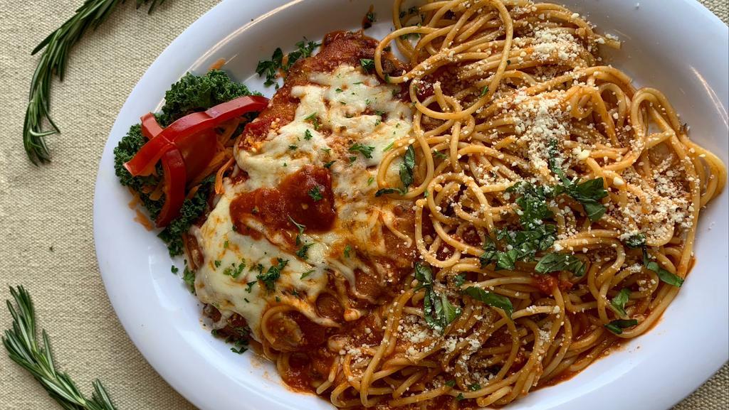 Spaghetti Chicken Parm · Chicken parmigiana with spaghetti and homemade tomato sauce topped with parmesan cheese.