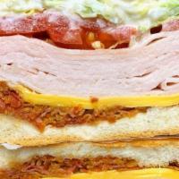 Supreme Turkey Club · Smoked turkey, Indiana bacon, Romaine lettuce, Plum tomatoes, &. Light mayonaise. (Recommend...