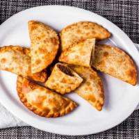 Empanada · Cheese, beef, chicken, ham and cheese or guava and cheese.