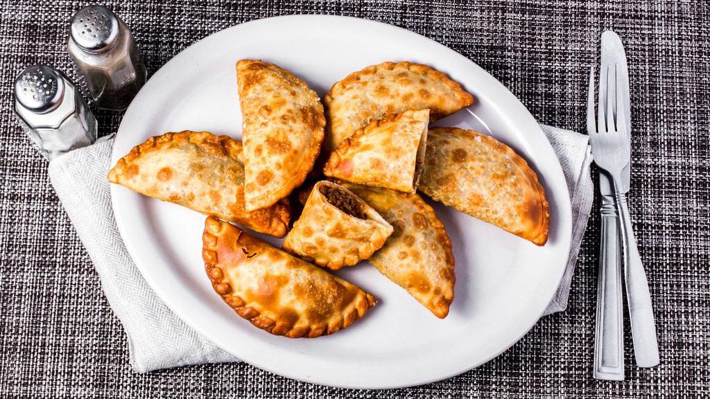 Empanada · Cheese, beef, chicken, ham and cheese or guava and cheese.