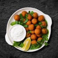 Arabian Falafel · Mashed chickpea and fava bean mix, seasoned with fresh herbs and pan-fried crisp.