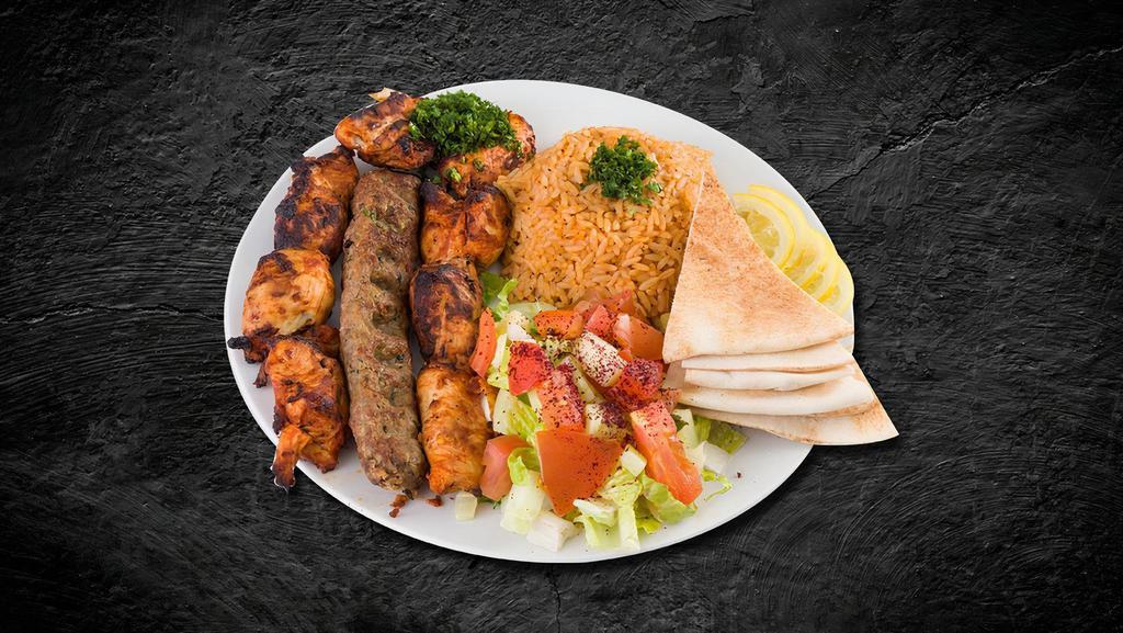 Kefta Kabob Dinner · Grilled ground lamb mixed with chopped onions, parsley and spices served with grilled vegetables and rice.