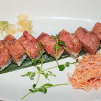Spicy Trio · Tuna, salmon, yellowtail, avocado and sriracha topped with spicy tuna served with side of ka...