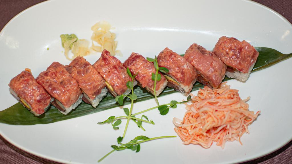 Spicy Trio · Tuna, salmon, yellowtail, avocado and sriracha topped with spicy tuna served with side of kani.