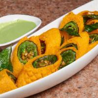 Cut Mirchi · Extra deep fried crispy hot peppers in chickpea with our batter.