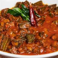 Bhindi Masala · Fried okra cooked with bell peppers in onion and tomato sauce with spices.
