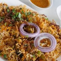 Vegetable Biryani · Basmati rice cooked with vegetable, blendedwith herbs, and spices, then garnished with onion...