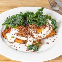Sweet Potato Toast · Two sunny side up eggs, crispy quinoa, herbed goat cheese, and kale chips on top of grilled ...