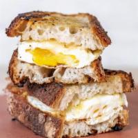 Egg & Cheese Sandwich · Two fried eggs, with Cabot cheddar cheese on grilled filone-Italian bread.