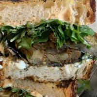 Grilled Eggplant Sandwich · Grilled & roasted eggplant slices, whipped feta, harissa aioli, fried capers, baby arugula o...