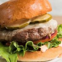 Stocked Burger · Beef patty with white cheddar cheese, lettuce, tomatoes, red onion, pickles and a house-made...
