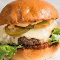 Mister Spicy Burger · Beef patty with pickled jalapeños, double layer of white cheddar cheese, lettuce, red onion,...