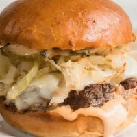 Reuben Burger · A pastrami spice rubbed beef patty with sauerkraut, swiss cheese, pickles and a house-made S...