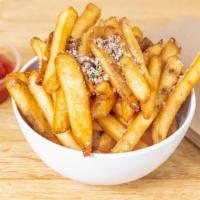 Truffle Fries · Crispy french fries tossed in truffle zest and grated parmesan cheese.