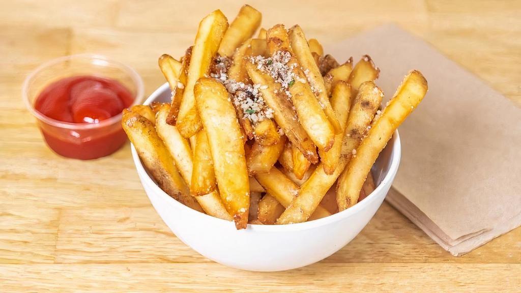 Truffle Fries · Crispy french fries tossed in truffle zest and grated parmesan cheese.