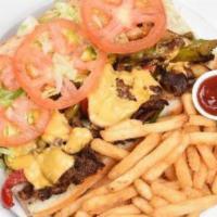 Philly Cheese Steak · Real sirloin steak, American cheese, grilled onions and peppers.