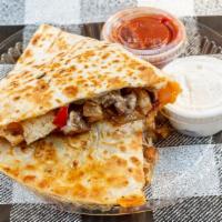 Chicken And Steak Quesadilla · Includes sour cream and salsa on the side.