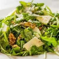 Arugula Salad · Baby arugula, shallots, sliced apple, lemon, walnuts and shaved grana padano.