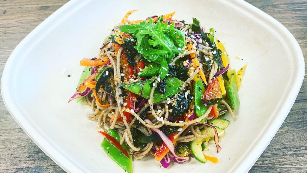Soba Noodle Salad · Soba Noodle, Carrot, Red Cabbage, Bell Pepper, Red Onion, Scallion, Radish, Tomato, Wakame Seaweed, Herbs, Spices, Soba Salad Dressing.