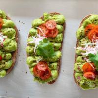 Avocado Toast · Toasted Multigrain Bread, Joe-Joe’s Signature Avocado Mash, Radish, Tomato, Cilantro, Spice,...