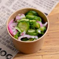 Cucumber Salad · Cucumber and Red Onions tossed in a Fresh Lemon Juice.