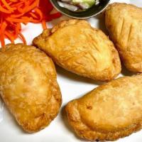 Curry Puff · Chicken and potato onion curry powder in puff pastry.