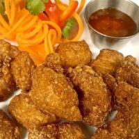 Crispy Chicken Pops · Served with sweet chili sauce.