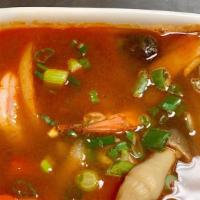 Tom Yum Soup · Spicy. Hot and sour. Shrimp with fresh lemongrass, kaffir, lime leaves, mushroom, chiles.