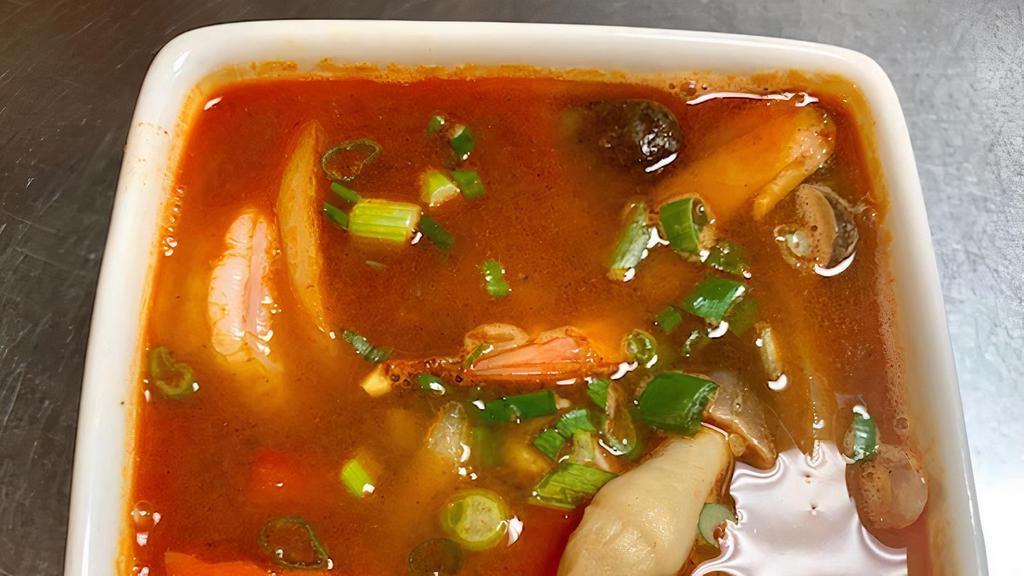 Tom Yum Soup · Spicy. Hot and sour. Shrimp with fresh lemongrass, kaffir, lime leaves, mushroom, chiles.