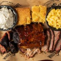 The Ultimate Platter · 3 meats, 4 ribs, 3 sides, & 2 cornbread.
1820-2740 Cal