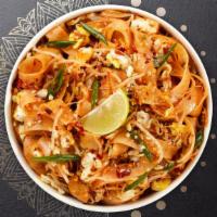 Pretty Pad Thai · (Spicy) Flat rice noodles sauteed in a light spicy sweet sauce, with browned tofu, bean spro...